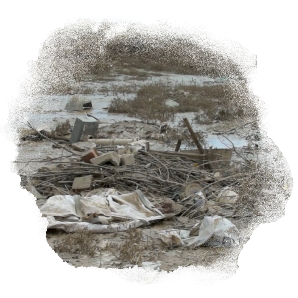 A photo of the debris in a muddy field