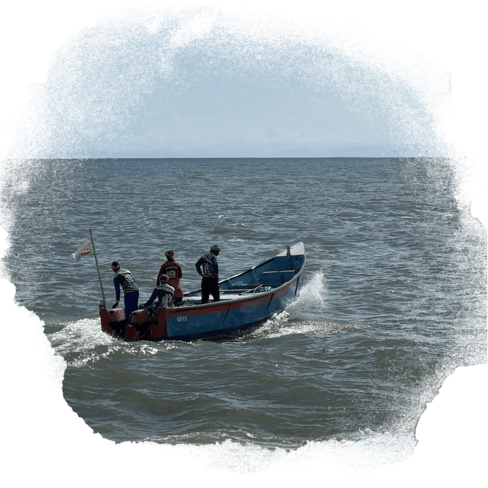 A photo of a fishing boat heading out to sea