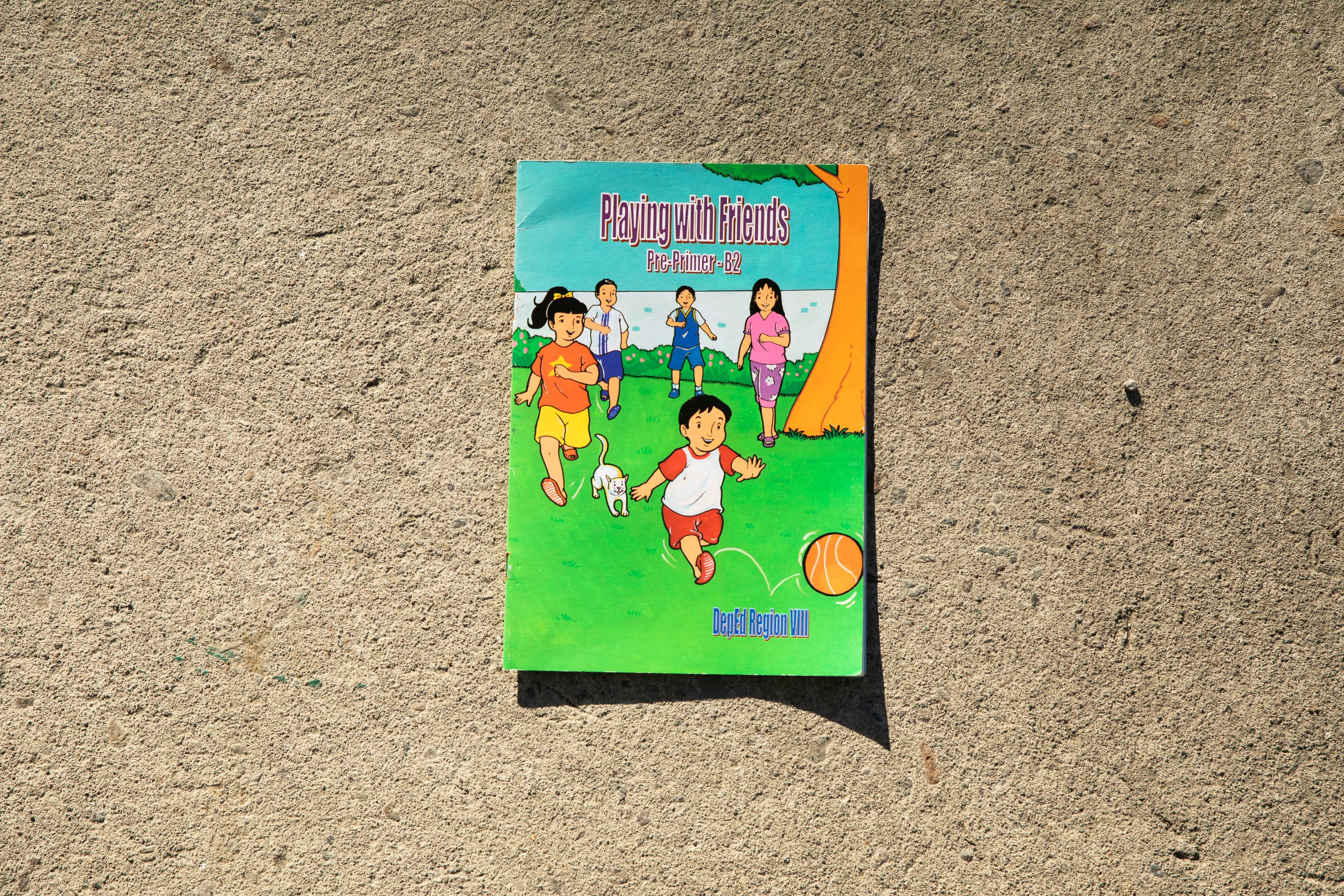 A close up photo of Queenee's object of memory: a kintergarten book