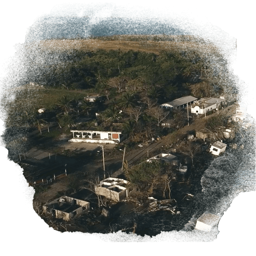 A photo of a the damaged buildings on the shore
